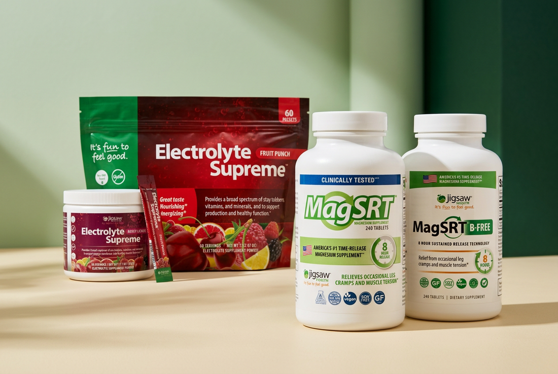 Jigsaw Health MagSRT magnesium bottles and Electrolyte Supreme drink mixes arranged on a cream surface against a soft green background.