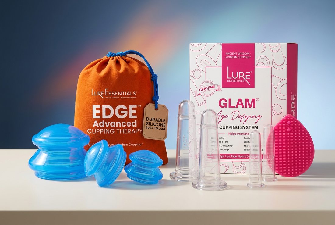 Lure Essentials blue EDGE cupping cups with an orange pouch and clear GLAM facial cups with pink-and-white packaging arranged on an ivory spa countertop.