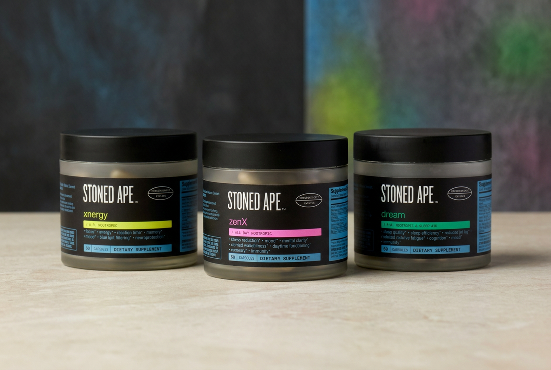 Stoned Ape Xnergy, ZenX, and Dream supplement jars with lime, pink, and green label accents arranged on a light stone surface.