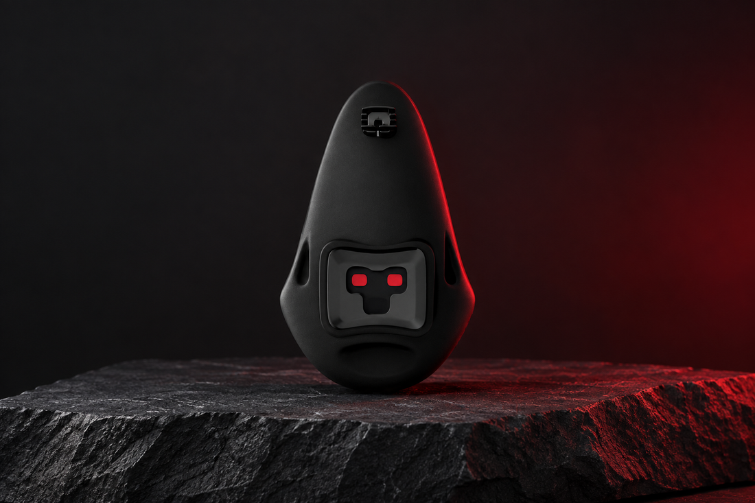 Testolite PRO black device on a charcoal display surface against a graphite background with subtle deep-red lighting.