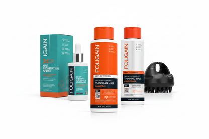 FOLIGAIN Men's Advanced Scalp Support Stack featuring 2dDR Serum, 473ml Shampoo, Conditioner and Black Scalp Exfoliator Massager arranged diagonally on white background