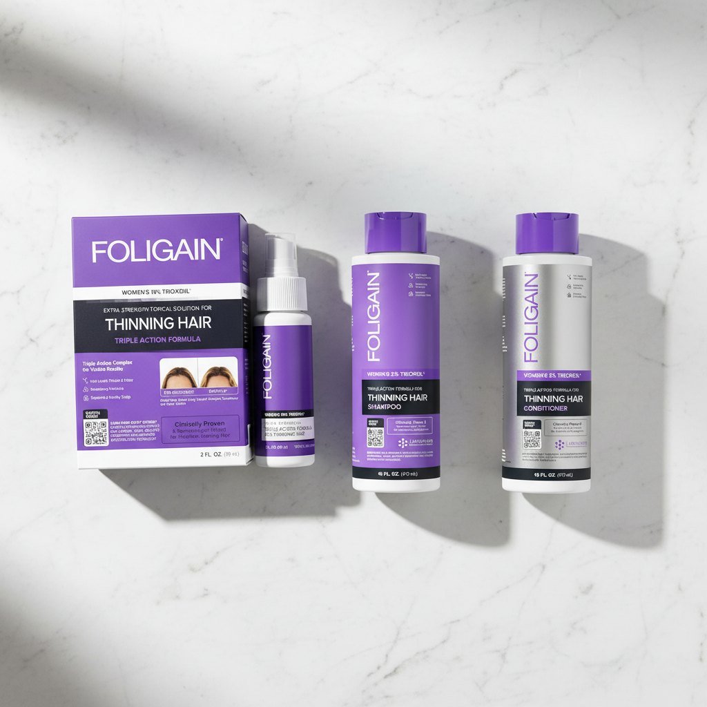 FOLIGAIN Women's TRIOXIDIL hair care bundle on white marble surface — shampoo, conditioner and topical serum top-down view