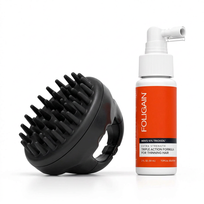 Men's TRIOXIDIL spray bottle beside black silicone scalp massager with bristles visible.