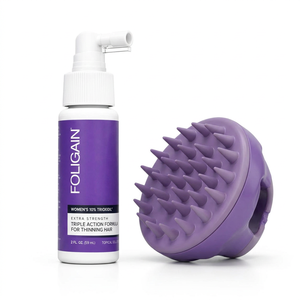 Women's FOLIGAIN 10% TRIOXIDIL bottle with sideways spray nozzle beside a purple silicone massager showing its bristles.