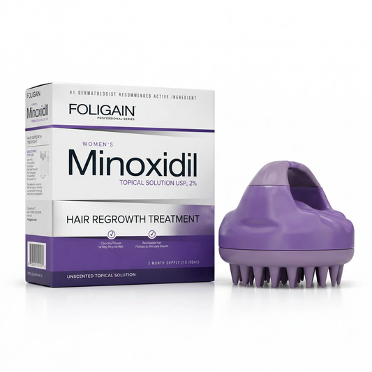 FOLIGAIN women's 2% minoxidil three-month supply carton beside a purple silicone scalp massager on white.