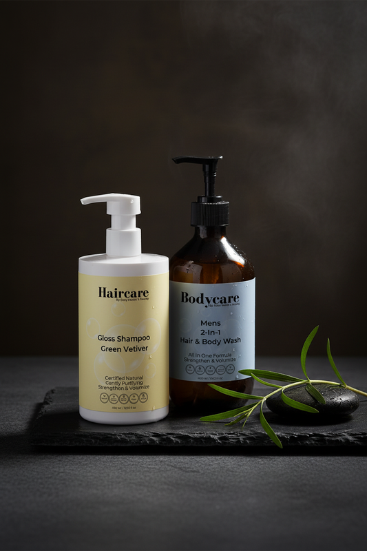 Gloss Shampoo Smoky Green Vetiver and Mens 2-in-1 Hair & Body Wash side by side on a dark slate counter with vetiver grass and a dark stone — gloss and grooming bundle by Daily Health & Beauty