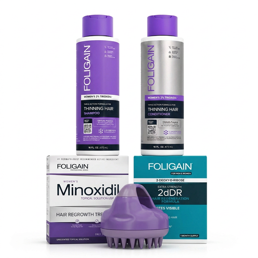 FOLIGAIN women's complete scalp care bundle with shampoo and conditioner behind minoxidil and 2dDR cartons and a purple massager.