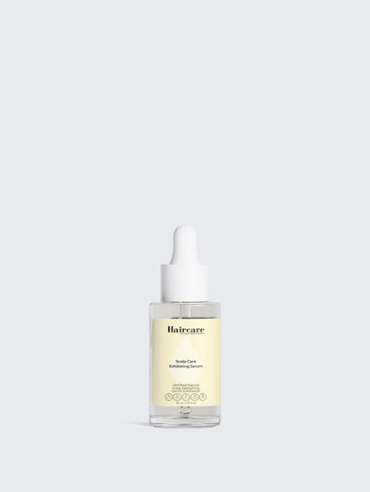 Applying Scalp Care Exfoliating Serum to dry scalp — gently exfoliates, relieves discomfort, supports fuller-looking hair