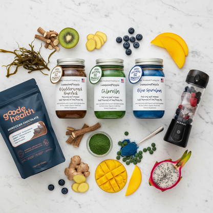 Organic Ocean & Earth Superfood Sea Moss Gel Bundle flat lay featuring Bladderwrack Burdock, Chlorella, and Blue Spirulina sea moss gel jars, Goode Health Superfood Shake, and BLENDi Pro+ Portable Blender with bladderwrack seaweed, burdock root, chlorella powder, blue spirulina, ginger, and blueberries on a marble surface — Daily Health & Beauty.