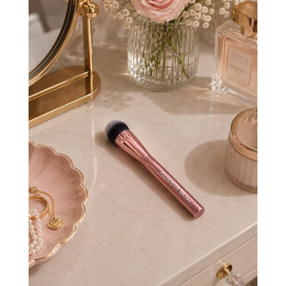 Brocha para base de maquillaje de oro rosa