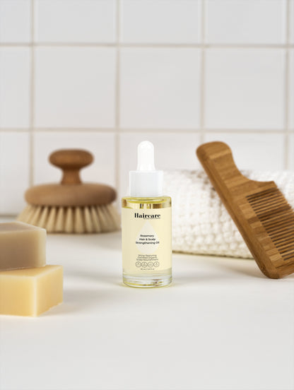 Rosemary Hair & Scalp Oil applied to scalp — restores shine, strengthens brittle hair, stimulates circulation