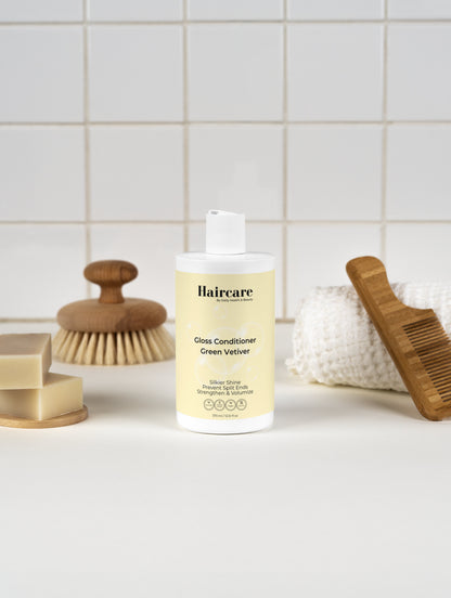 Gloss Conditioner Smoky Green Vetiver in bathroom — earthy vetiver scent, salon-quality conditioning for all hair types